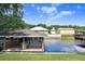Waterfront view showcasing the dock with a boat lift, ideal for enjoying water activities at 93 Bream St, Haines City, FL 33844