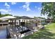 The dock features a covered area with ample space and steps leading to the water at 93 Bream St, Haines City, FL 33844