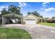 Attractive home with a two-car garage, covered boat storage, and lush lawn, perfect for outdoor enjoyment at 93 Bream St, Haines City, FL 33844