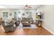 Cozy living room with comfortable seating, wood floors, and natural light, creating a welcoming atmosphere at 93 Bream St, Haines City, FL 33844