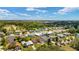 Aerial view showcasing the community with well-maintained homes and lush green spaces at 1032 Kelsea Cir, The Villages, FL 32159