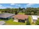 Aerial backyard view with a patio and green space perfect for outdoor entertaining at 1032 Kelsea Cir, The Villages, FL 32159
