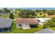 Backyard view featuring a screened in porch and patio at 1032 Kelsea Cir, The Villages, FL 32159