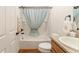 Bathroom with a shower-tub combo and seashell themed shower curtain at 1032 Kelsea Cir, The Villages, FL 32159
