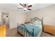 Bedroom with ceiling fan, closet and furnishings at 1032 Kelsea Cir, The Villages, FL 32159