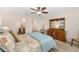 Bedroom with ample storage, neutral carpet, and ensuite bathroom at 1032 Kelsea Cir, The Villages, FL 32159