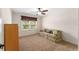 Bedroom featuring a ceiling fan, window, and furnishings at 1032 Kelsea Cir, The Villages, FL 32159