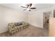 Bedroom featuring a ceiling fan, closet and furnishings at 1032 Kelsea Cir, The Villages, FL 32159