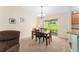Cozy dining area with a sliding door leading to the backyard at 1032 Kelsea Cir, The Villages, FL 32159