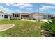 Charming single-story home with well-maintained lawn and manicured landscaping at 1032 Kelsea Cir, The Villages, FL 32159