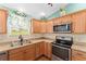 Updated kitchen with stainless steel appliances, generous counter space, and plenty of storage at 1032 Kelsea Cir, The Villages, FL 32159