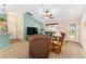 Spacious living room with plush seating, ceiling fan, and neutral carpet throughout at 1032 Kelsea Cir, The Villages, FL 32159