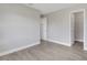 A clean and bright bedroom with neutral paint and modern flooring at 2151 Groveglen S Ln, Lakeland, FL 33813