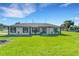 Charming single-story home with a well-manicured lawn and black trim windows at 2151 Groveglen S Ln, Lakeland, FL 33813