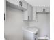 A detailed look at the modern gray cabinetry and quartz countertops in the kitchen at 2151 Groveglen S Ln, Lakeland, FL 33813
