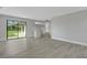 Bright living area with sliding glass doors and modern flooring throughout at 2151 Groveglen S Ln, Lakeland, FL 33813