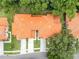 A top-down shot shows the tile roof detail and mature landscaping of this property at 2256 Wekiva Village Ln, Apopka, FL 32703