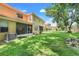 Expansive backyard with lush green grass and a screened patio provides ample outdoor space at 2256 Wekiva Village Ln, Apopka, FL 32703