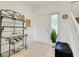 Bright foyer with tiled flooring, a staircase, and a decorative shelf adding character at 2256 Wekiva Village Ln, Apopka, FL 32703