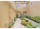 Inviting front entrance with a well-maintained garden and a walkway leading to the front door at 2256 Wekiva Village Ln, Apopka, FL 32703