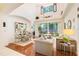 Bright living room with high ceilings, hardwood floors, and stylish contemporary furniture at 2256 Wekiva Village Ln, Apopka, FL 32703