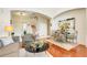 Well-lit living room featuring hardwood floors, stylish furniture, and an open layout at 2256 Wekiva Village Ln, Apopka, FL 32703