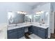 Elegant bathroom with dual vanities, granite countertops, and ample lighting at 2423 Turnberry Dr, Oviedo, FL 32765