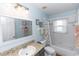 Inviting bathroom features granite counters, bathtub, and updated fixtures at 2423 Turnberry Dr, Oviedo, FL 32765