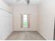 Neutral bedroom with a window, closet, neutral walls and neutral carpet at 2423 Turnberry Dr, Oviedo, FL 32765