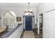 Welcoming foyer with hardwood floors, arched windows, and a view of the dining room, creating an open feel at 2423 Turnberry Dr, Oviedo, FL 32765
