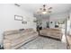 Comfortable living room with two couches, ceiling fan, and view to backyard pool at 2423 Turnberry Dr, Oviedo, FL 32765