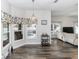 Inviting living room featuring a pool view, stylish bar cart, and wood-look flooring at 2423 Turnberry Dr, Oviedo, FL 32765