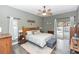 Relaxing main bedroom with a view of the pool, ceiling fan, and neutral decor at 2423 Turnberry Dr, Oviedo, FL 32765