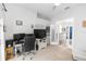 Bright home office featuring a modern desk setup and elegant glass paneled doors at 2423 Turnberry Dr, Oviedo, FL 32765