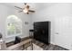 Office with a window, a desk, and a black storage cabinet at 2423 Turnberry Dr, Oviedo, FL 32765