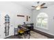 Bright office with a ceiling fan, a window, and a desk at 2423 Turnberry Dr, Oviedo, FL 32765