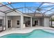 Relaxing screened-in pool area with covered patio, ideal for outdoor entertaining and enjoying the Florida sunshine at 2423 Turnberry Dr, Oviedo, FL 32765
