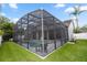 Spacious screened pool enclosure, providing an outdoor oasis with comfortable seating and a refreshing pool at 2423 Turnberry Dr, Oviedo, FL 32765