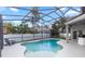 Sparkling pool with screened enclosure, offering privacy and a serene outdoor experience at 2423 Turnberry Dr, Oviedo, FL 32765