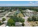 Wide aerial view displaying the property's location near community amenities and lush greenery at 3300 Glen Village Ct, Orlando, FL 32822