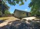 Backyard featuring a patio, fenced perimeter, and lush greenery for outdoor enjoyment at 3300 Glen Village Ct, Orlando, FL 32822