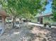 Lush backyard featuring a patio and mature trees, perfect for outdoor relaxation at 3300 Glen Village Ct, Orlando, FL 32822