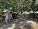 View of an outdoor workspace featuring storage and shaded space in the backyard at 3300 Glen Village Ct, Orlando, FL 32822