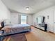Well-lit bedroom with large window and mirrored dresser, offering ample space at 3300 Glen Village Ct, Orlando, FL 32822