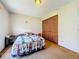 Bedroom featuring a window for natural light, a wardrobe, and floral bedding at 3300 Glen Village Ct, Orlando, FL 32822