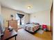 Cozy bedroom featuring a window for natural light and comfortable furnishings at 3300 Glen Village Ct, Orlando, FL 32822
