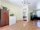 Bright dining area features tile flooring, additional storage, and a glimpse into a cozy bedroom at 3300 Glen Village Ct, Orlando, FL 32822