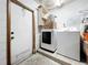 Laundry room with washer, dryer, and side door at 3300 Glen Village Ct, Orlando, FL 32822