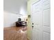 View from the front door of the living room with tile flooring, a sofa and view to other rooms at 3300 Glen Village Ct, Orlando, FL 32822