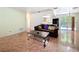 Living room with tile flooring, sofa, coffee table, and view to the kitchen and dining area at 3300 Glen Village Ct, Orlando, FL 32822
